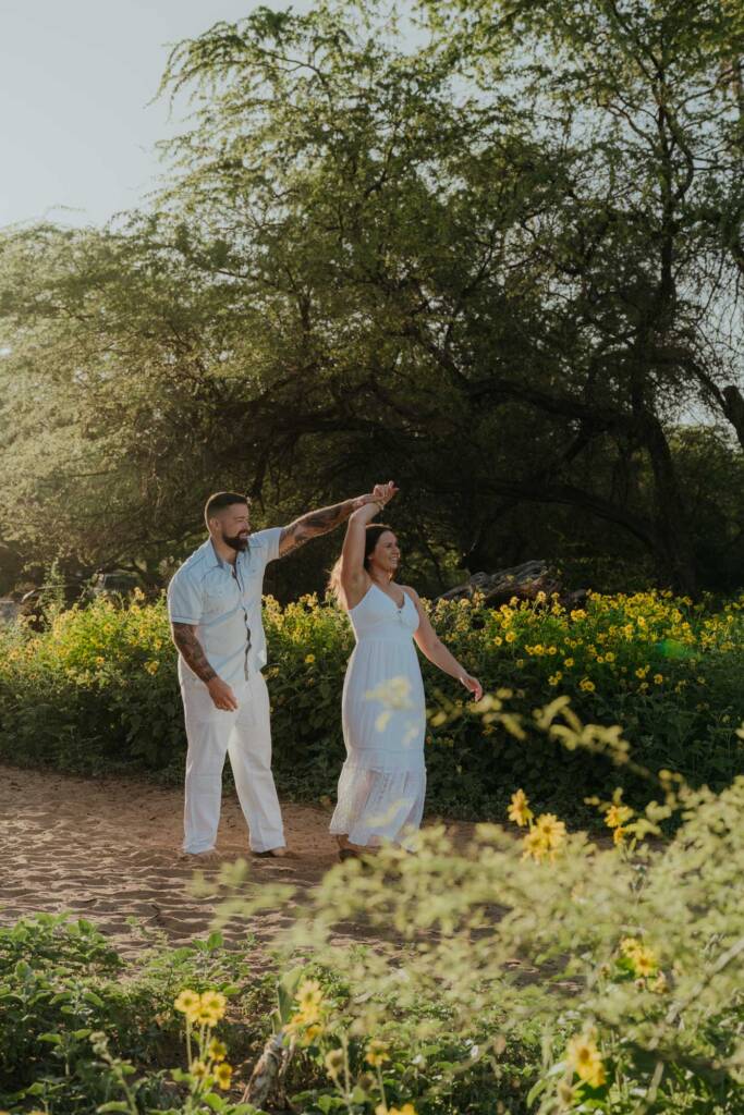 Kristen and Tyler walking along Po‘olenalena Beach during their Maui engagement session
