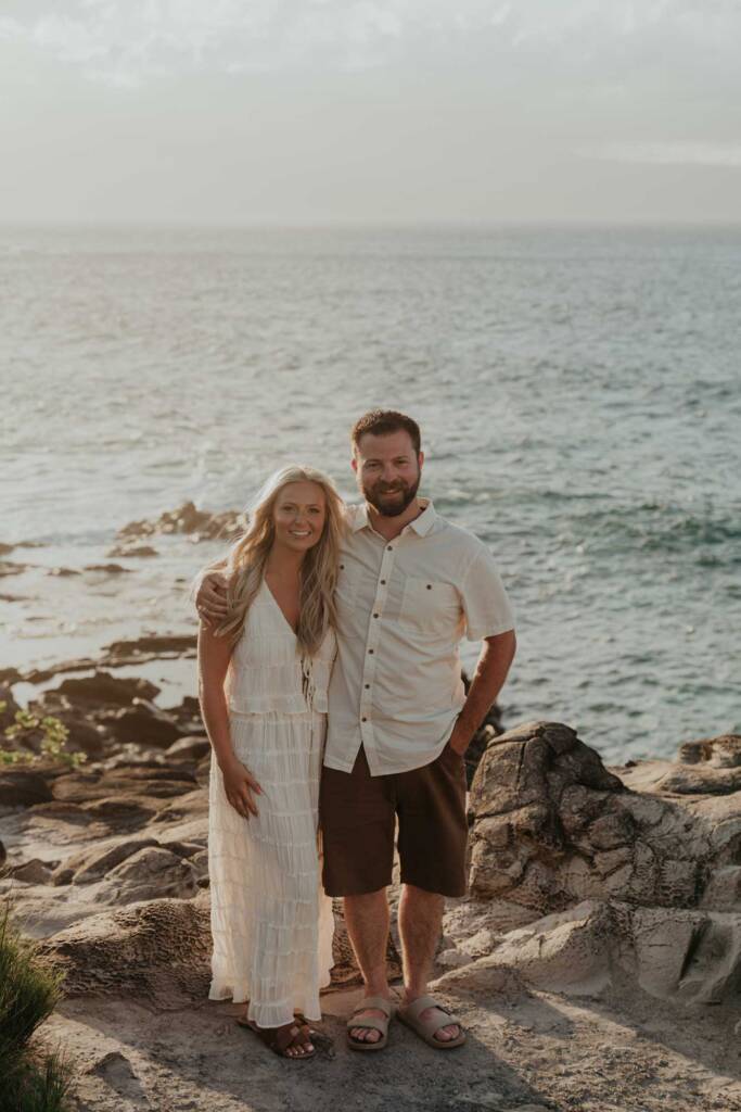family standing on cliff for maui family photoshoot